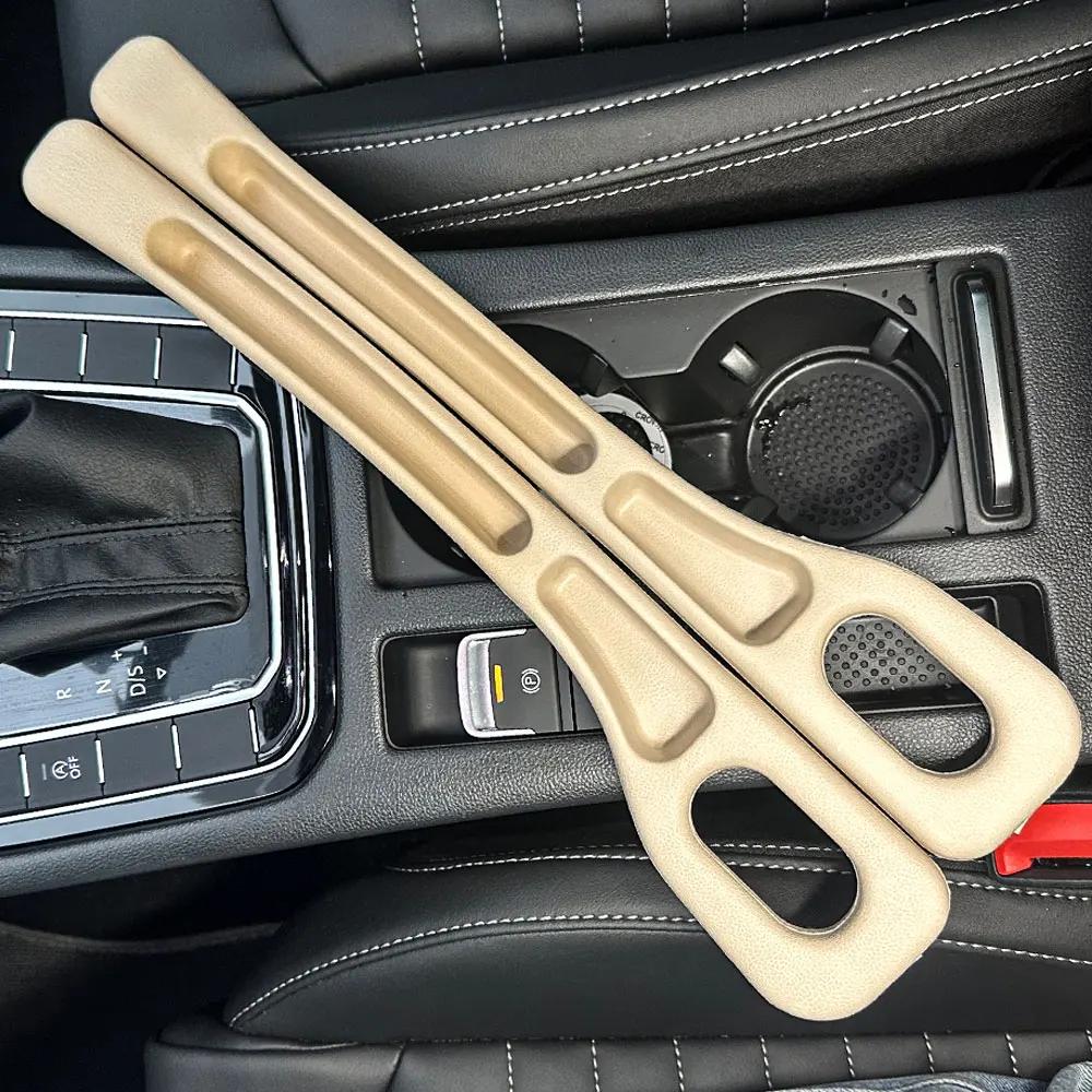 

2 шт. Органайзер для заповнення щілин для автомобільних сидінь Pu Водонепроникна заглушка для автомобільних сидінь з 2 пазами Зберігання щілин для сидінь Аксесуари для авто інтер’єру