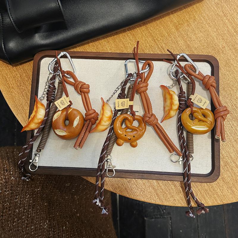 Yogodlns Cute Smiling Face Bread Woven Rope Dumpling Pendant Bag Accessory Handmade Trendy Bag Hanging Alkali Water Bread Bagel Bag Pendant