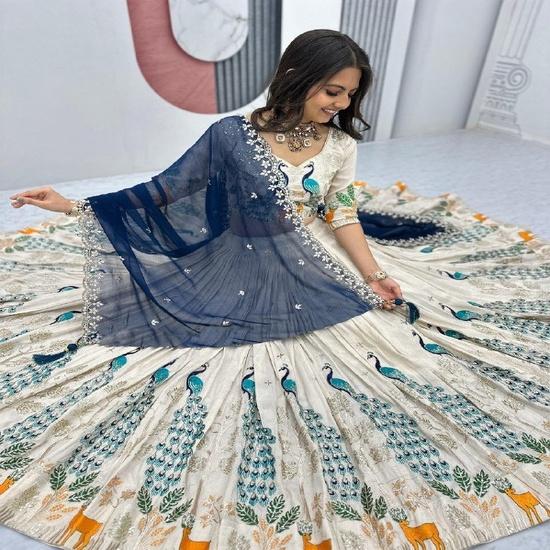 Off-White Pleated Silk Lehenga Choli with Blue Peacock Embroidery and Navy Net Dupatta UNSTITCHED