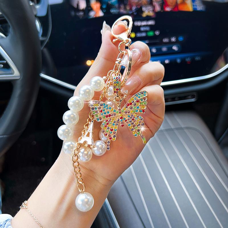 

Pearl Alloy Butterfly Keychain: Elegant Car & Bag Ornament for Women
