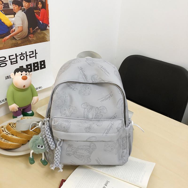 

Cute Bear Print Large Capacity Lightweight Backpack For Students Waterproof Nylon Material 15-inch Laptop Compartment Unisex Style