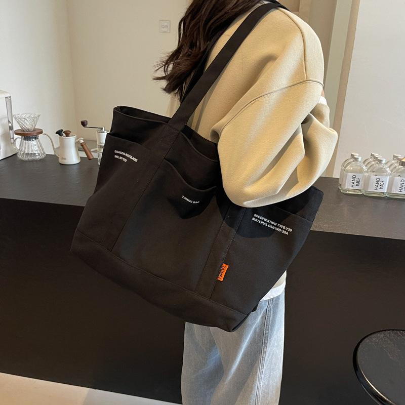 Canvas bag large capacity new casual fashion tote bag Japanese literary niche commuter shoulder bag