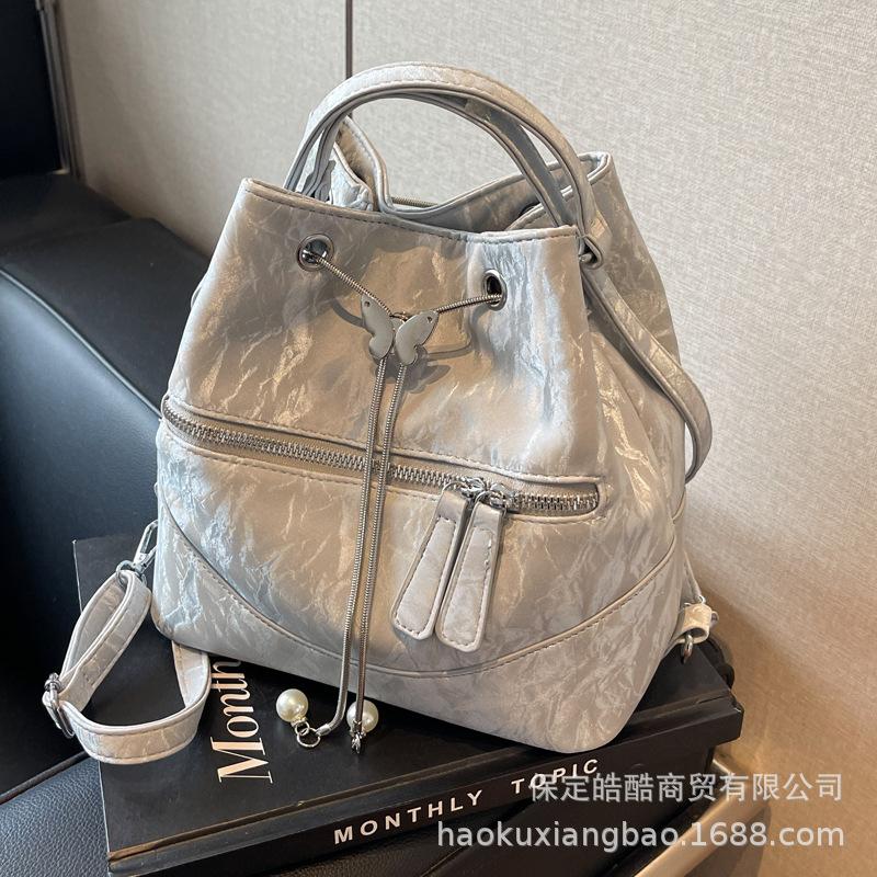 Silver bag women's 2025 new fashion backpack design sense school bag college student shoulder crossbody bucket bag