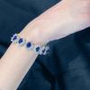 LAVINA Royal Inspired Sophisticated Luxury Oval Cut CZ Diamond Bracelet for and Proms Weddings, Parties, (Small, Blue)