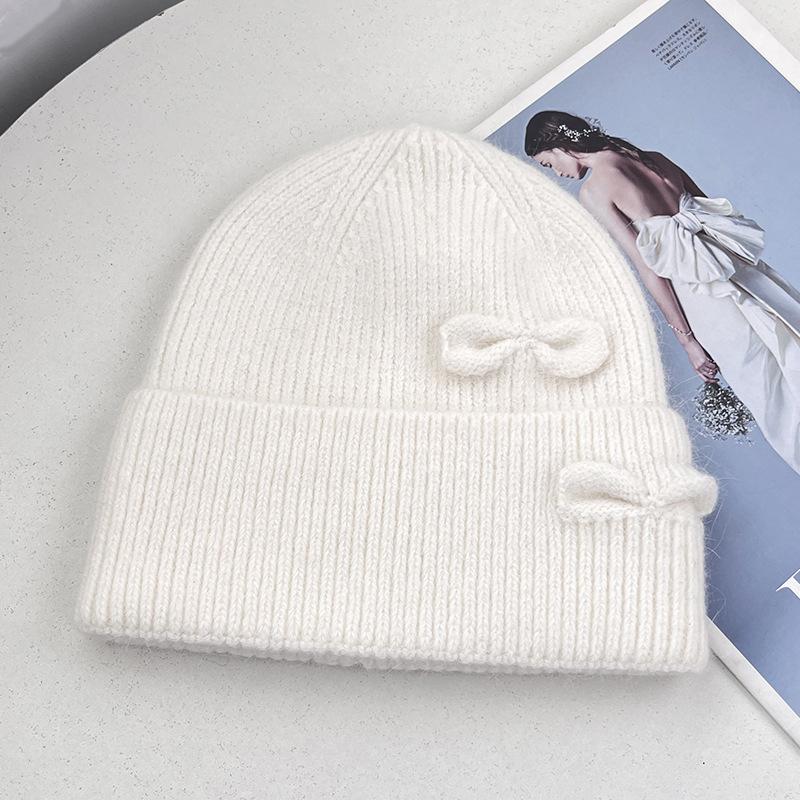 New double bow knitted hat women's autumn and winter sweet warm wool hat big head circumference show face small cold hat