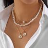 Stacked pearl necklace collection European and American retro baroque special-shaped pearl OT buckle blade snake chain tassel