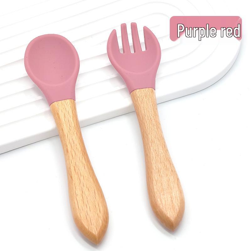 

Children s Silicone Baby Spoon with Wooden Handle - Soft, Heat-Resistant, Food-Grade Rubber Feeding Utensil for Infants.