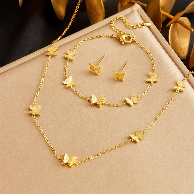Gold Tone Sandblast Butterfly Jewelry Set: Necklace, Bracelet, Stud Earrings золотой