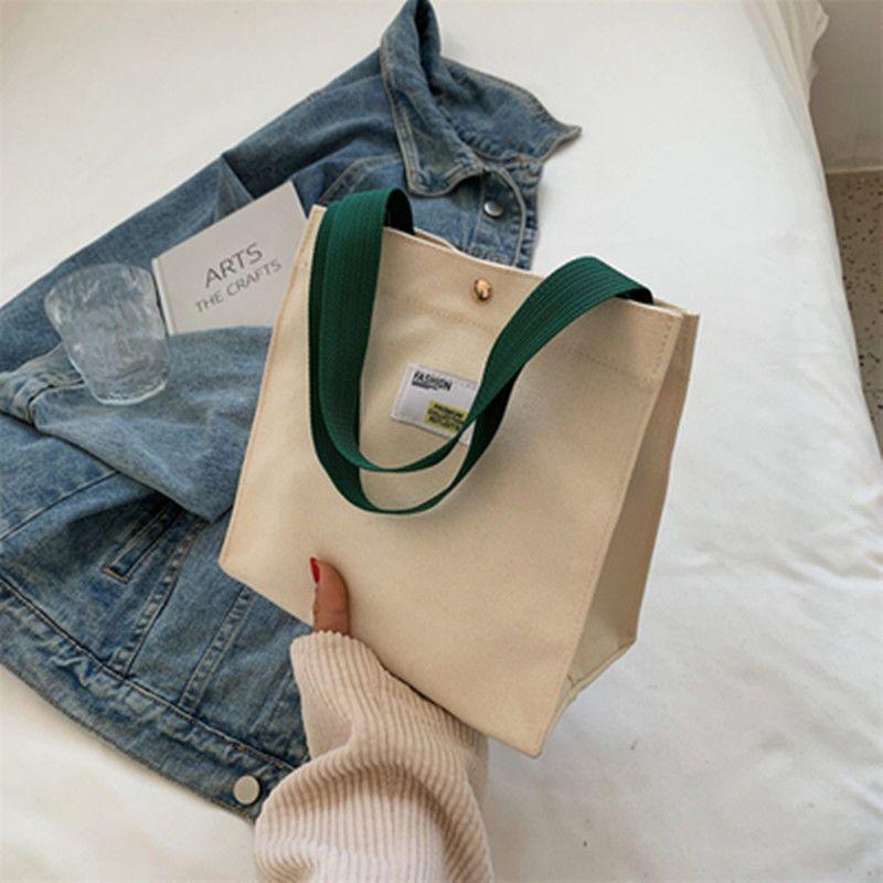 

Женская сумка, однотонная универсальная холщовая сумка, большая вместимость для работы, маленькая сумка, повседневная тканевая сумка для ручной переноски 21*12*21cm белый