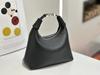 Leather lunch box bag, high-end niche casual messenger bag 2025 new hand-carried crescent bag, fashionable and simple portable