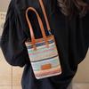 Niche lightweight versatile rainbow straw mobile phone bag spring and summer explosion leisure vacation style commuter messenger bag woman
