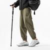 Functional waterproof charging pants spring and autumn loose tied feet casual breathable sports pants outdoor mountaineering trousers