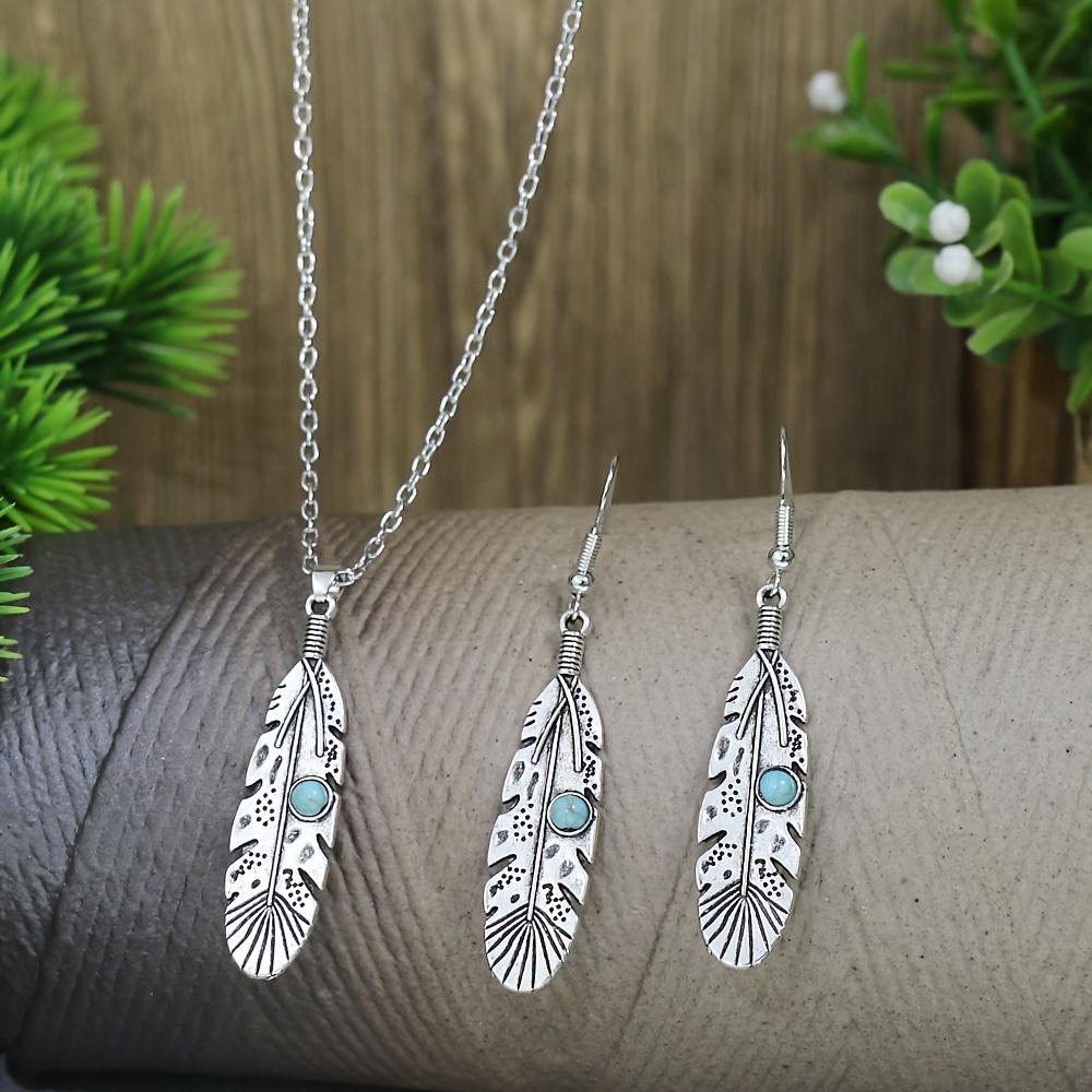 A retro ethnic-style ladies' earring and necklace set, featuring antique silver-colored leaves set in alloy and adorned with turquoise accents,