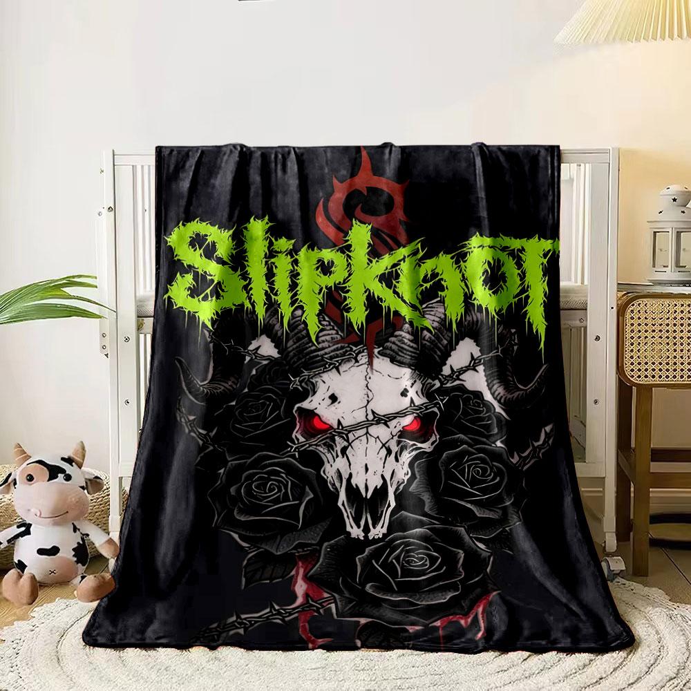 A demonic skull with horns, red eyes, black roses, and barbed wire. for all seasons blanket lunch break throw gift