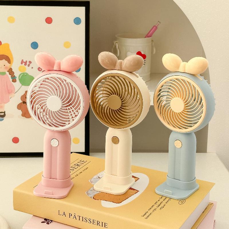 

Bow USB Rechargeable Silent Handheld Fan with Phone Holder - Portable, Cute, and Ideal for Women 3 Speed, 500mAh