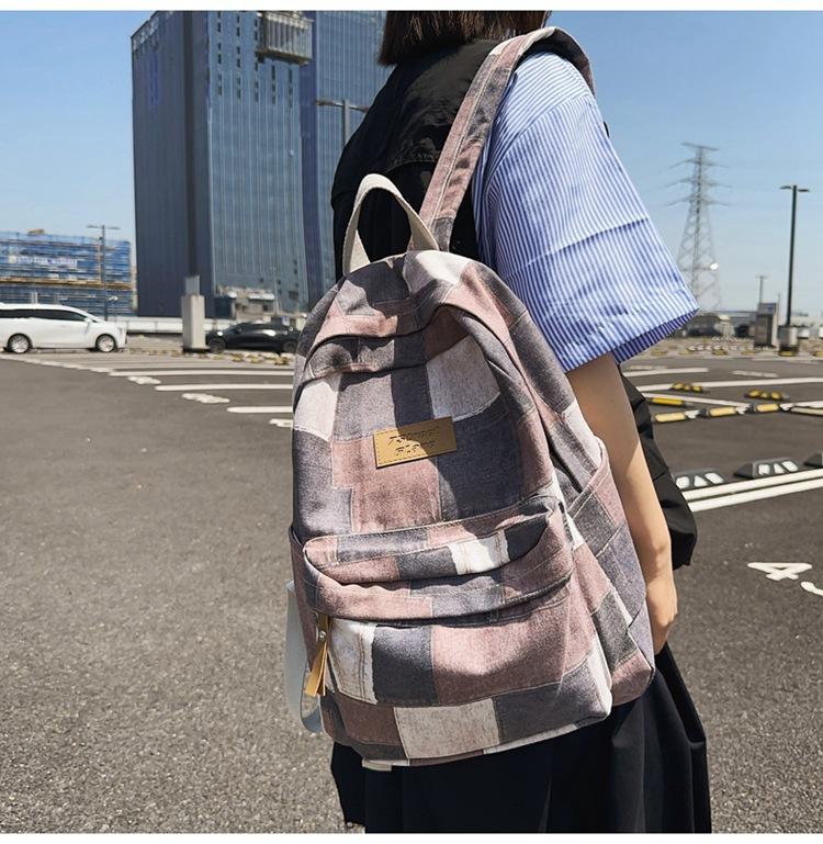 Large-capacity new middle school schoolbag, junior high school backpack, boys' casual versatile college student computer bag, women
