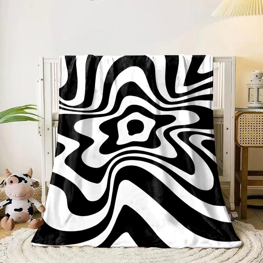 

A swirling black and white wave pattern with a distorted star-like center. for all seasons blanket lunch break throw gift 80cm x 120cm