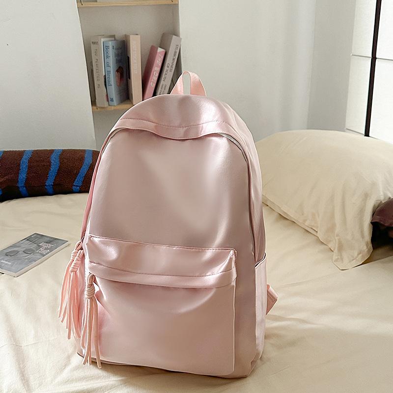 School bag solid color light and simple Korean version of college students Japanese versatile large-capacity small backpack girl light backpack