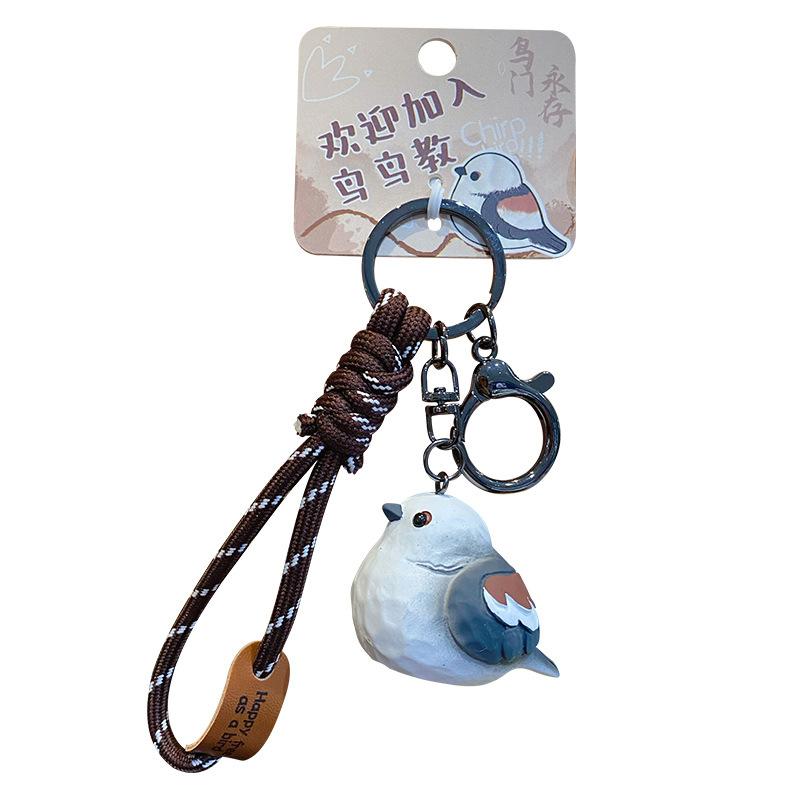 Original wood carving wind bird keychain pendant creative resin pearl bird couple keychain schoolbag pendant