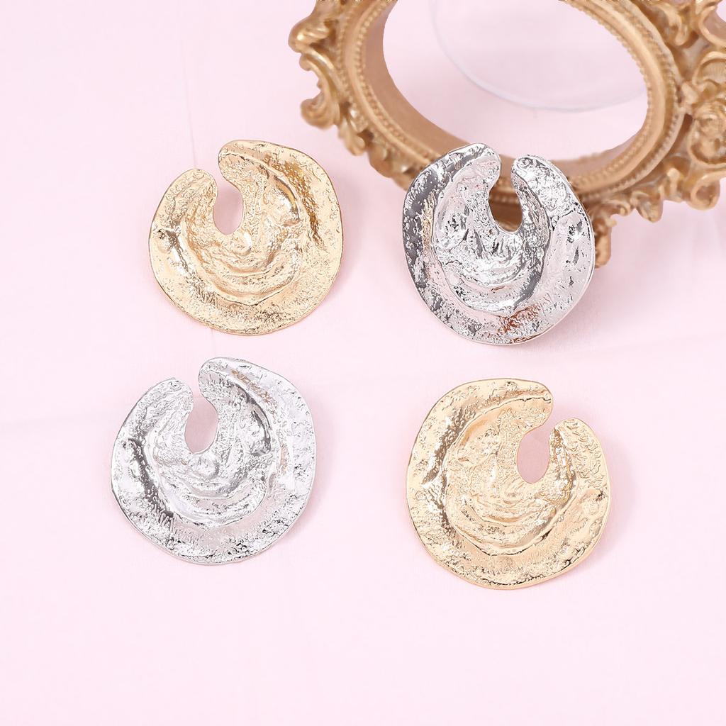 Light luxury new concave and convex texture irregular pleated geometric round stud earrings star trend catwalk model