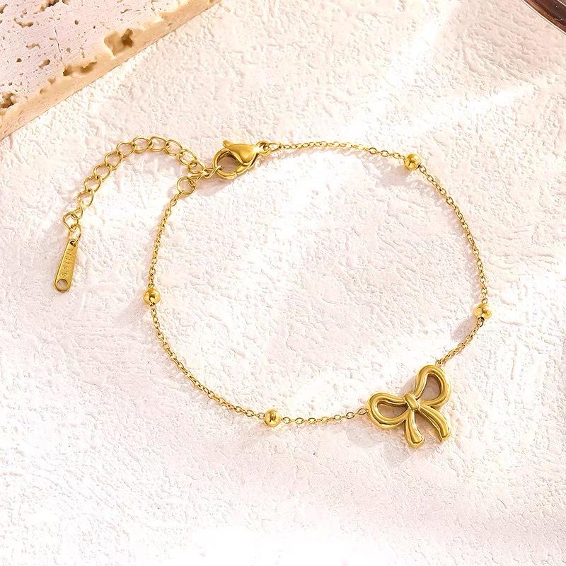 

Комплект из ожерелья и браслета с бантом из титановой стали — легкие, роскошные, не выцветающие, высококачественные аксессуары