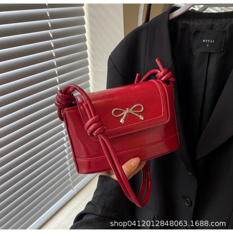 

This year, the popular bow messenger small bag 2025 new niche design commuter bag fashionable women s shoulder bag бордовый