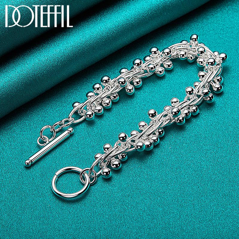 Bracelet de perles de raisin en argent avec breloques