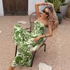 Summer New Style Vacation Fresh Trend One-piece Long Pants with High Waist and Plunging Neckline, Featuring Green Leaf Printed Design.