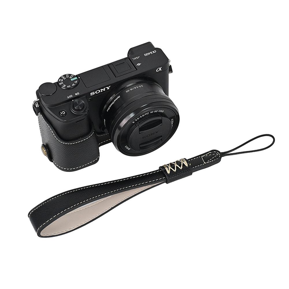 PU kožené pouzdro na polovinu těla fotoaparátu s potiskem dlaně pro Sony A6400 A6300 A6000 A6100, spodní kryt s otvorem na baterii a popruhem na ruku