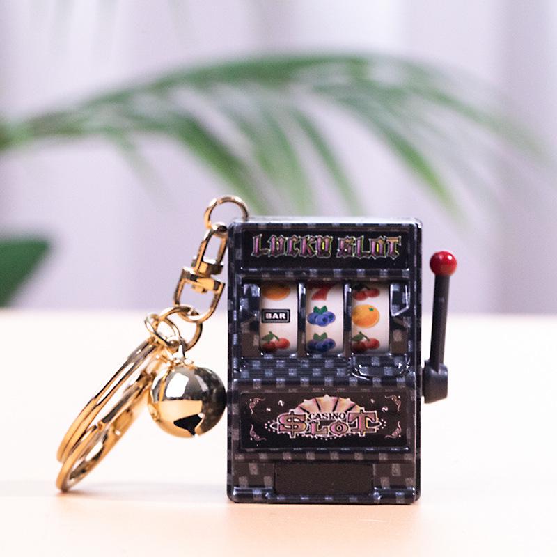 Gold-Plated Creative Tiger Fruit Machine Keychain Toy with Lottery Play Feature