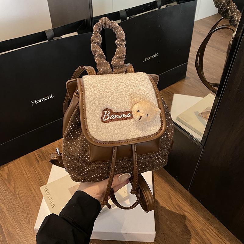 

New niche versatile bag women s autumn and winter retro niche design flip mini backpack bag