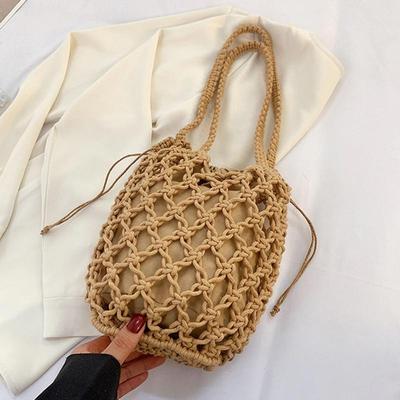 Bolso tejido de paja de diseño pequeño para mujer, nuevo bolso de verano de alta calidad, bolso de cubo de agua, bandolera de playa occidentalizada