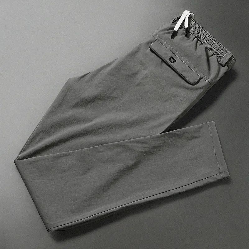 

Мужская одежда, модные однотонные повседневные брюки с карманами, лето 2023, повседневные удобные мужские брюки с эластичной резинкой на талии и шнурком 32 темно серый