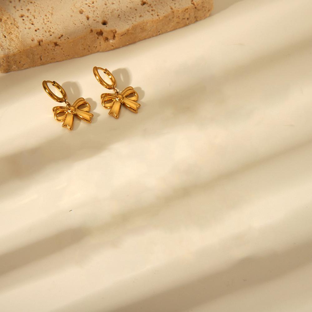 Chic Bow Coil Earrings: European & American Style In Stainless Steel