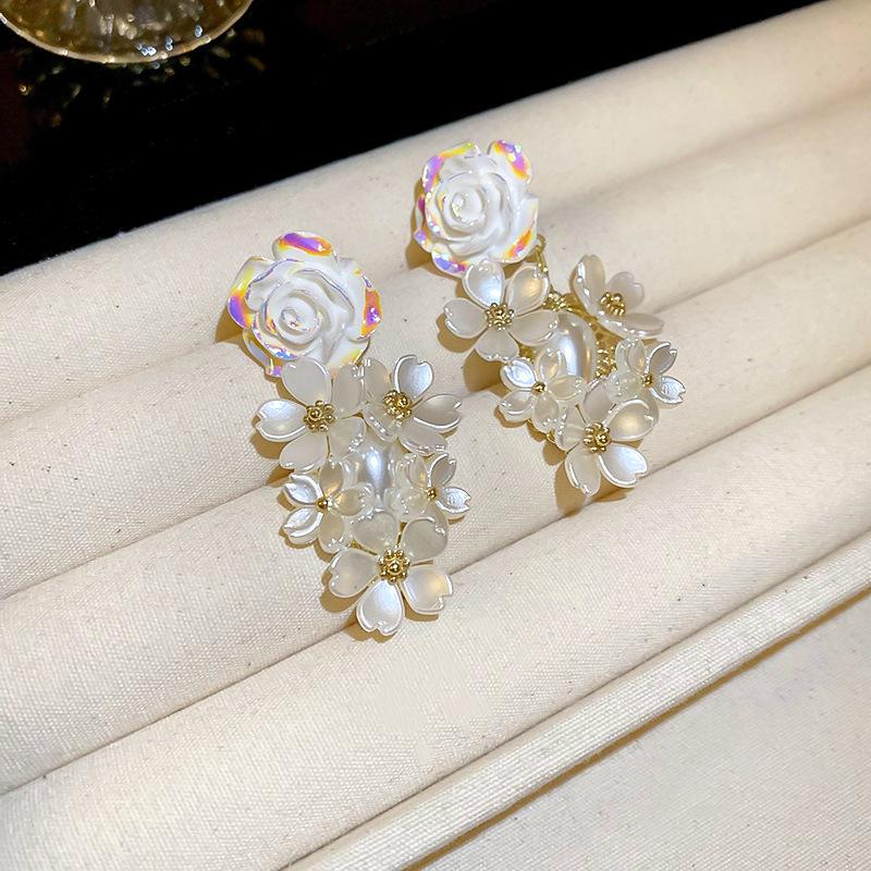 Silver Needle White Heart Tassel Earrings: Luxurious, Versatile, and Stylish Stud Earrings for Women.