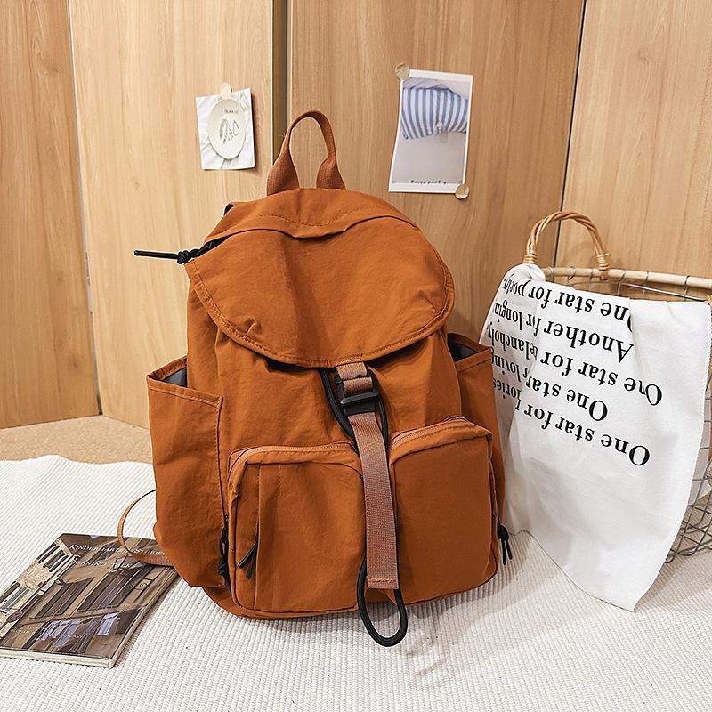 New high-value fresh and sweet backpack couple solid color simple mountaineering travel lightweight backpack