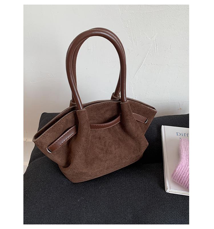 Frosted retro portable small bag women's 2025 new fashion bucket bag niche design messenger bag wing bag tide