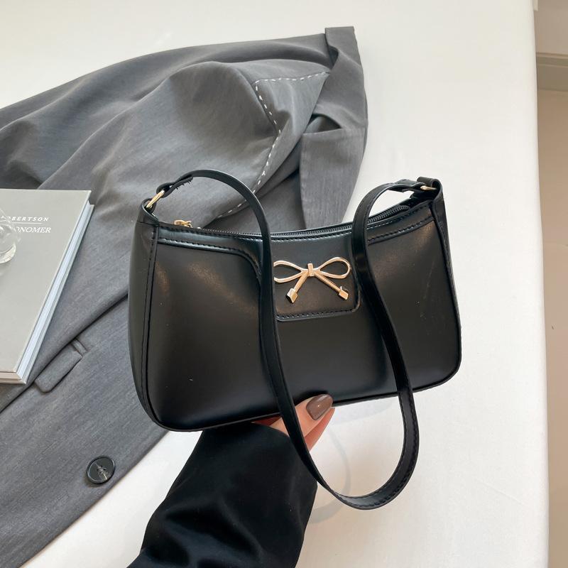 Fashion bow 2025 solid color new Korean version trendy texture foreign style commuting single shoulder underarm baguette bag women