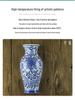 Hand-Painted Blue and White Ceramic Wall Vase with Floral and Bird Design