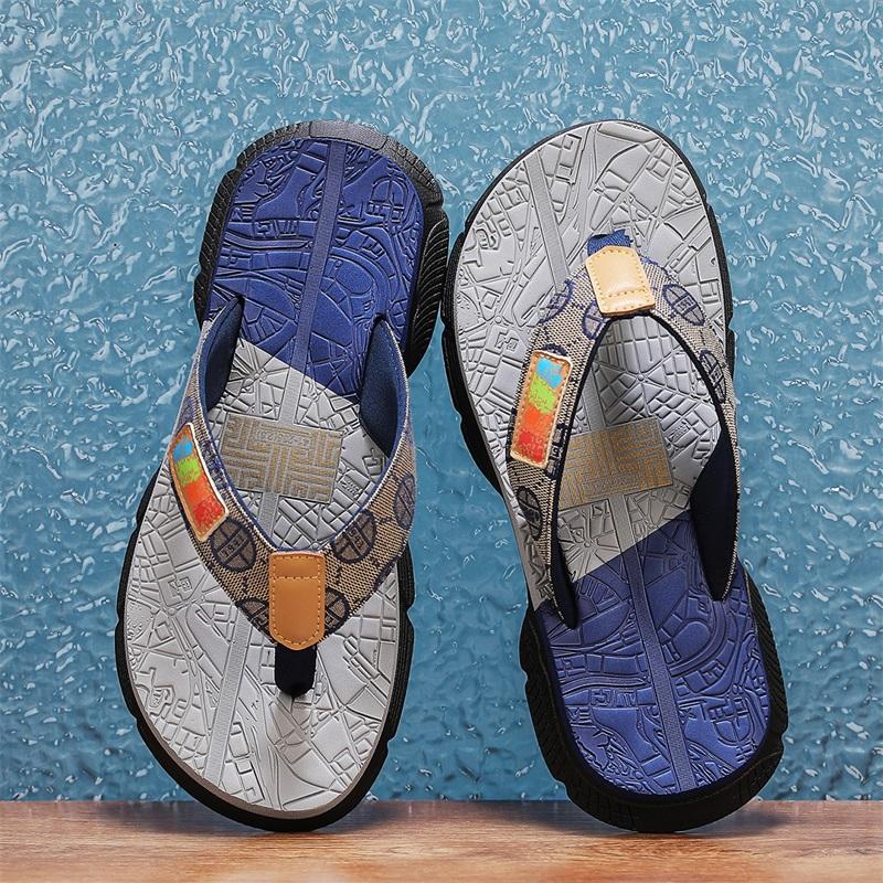 Fashion Men's colorful - pattern flip - flops. Upper with label, two - toned soles. Stylish, casual design. Comfortable & versatile.
