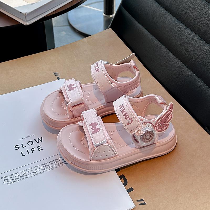 

Girls wings rotating button sandals spring and summer 2025 new children s hollow beach shoes fashion open-toed shoes 30 розовый