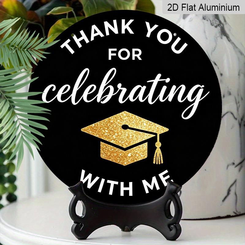 2D Flat Aluminum 2026 Graduation-themed Wall Hanging Is Available In Multiple Sizes. Its Black and Gold Glitter Graduation Cap Design Makes It A