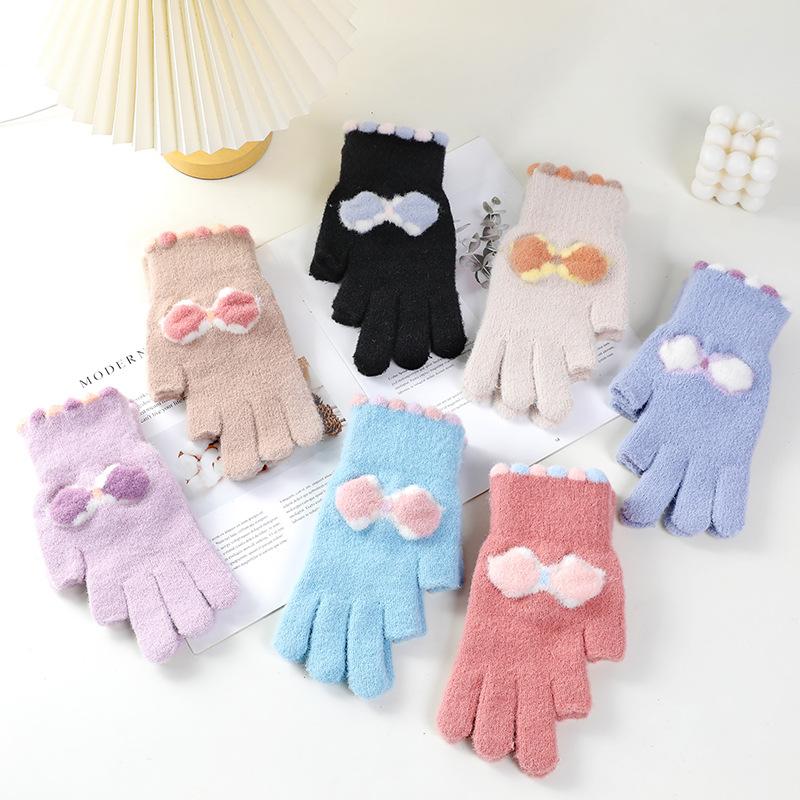 Wool gloves show two fingers, women keep warm in winter, knit for cold protection, draw and write, students play with mobile phones with two fingers