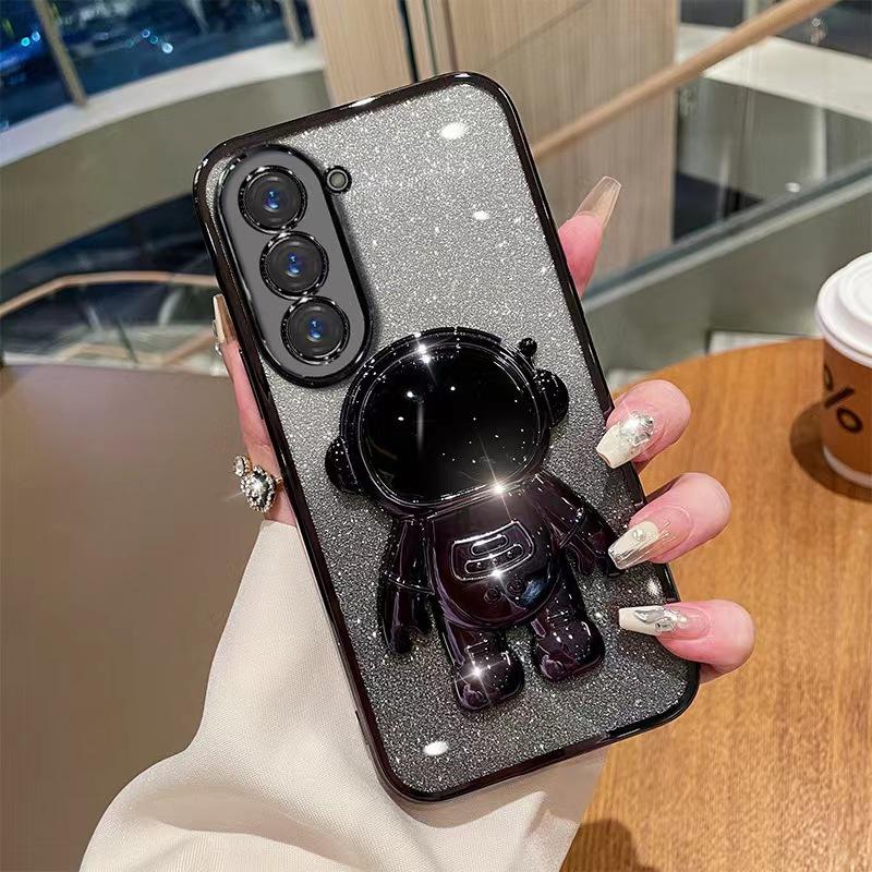 Astronaut Stand Suitable for Samsung S24ultra Mobile Phone Case S23Plus Gradient Flash Powder S22 Astronaut