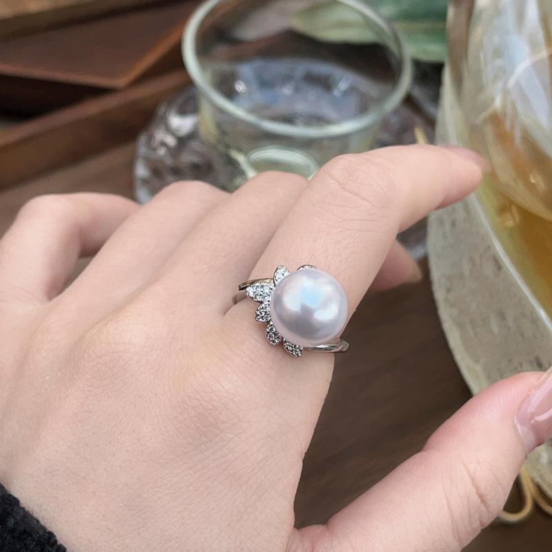 

Перстень з перлами Жіночий Легка розкіш Холодний вітер Вишуканий дизайн Розширене відчуття Регульоване кільце Порожній тримач Opening adjustable