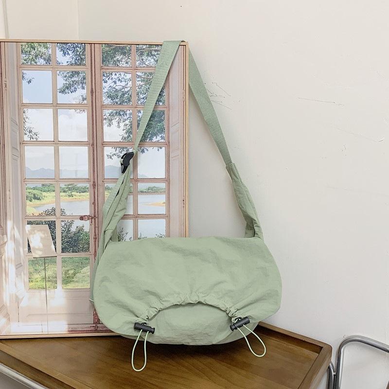 

Large capacity wide shoulder strap canvas bag crossbody bag women s niche design pleated dumpling bag shoulder bag