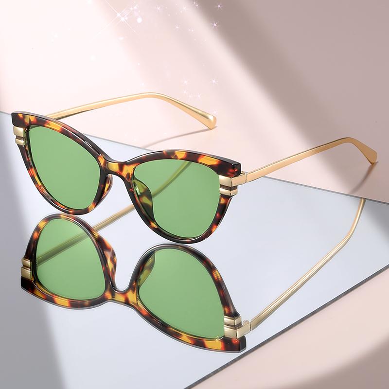 Fashion Cat Eye Sunglasses with Black Top Frame, Red Patterned Lower Frame, Gold Metal Arms, and Gradient Brown Lenses For