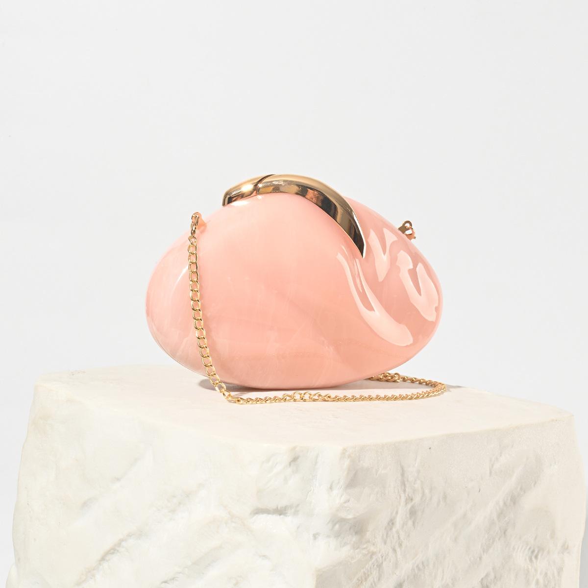 

2025 new oval acrylic leaf lock dinner bag fashion wind chain shoulder clutch bag cross-border