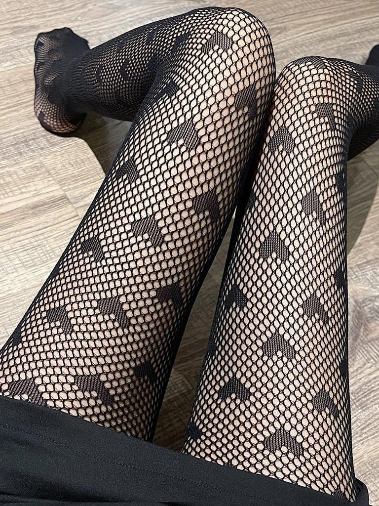 A pair of women's fishnet love pantyhose fashion thin heart-shaped transparent tights