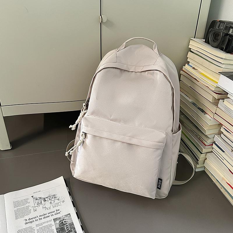 New trendy and cool men's casual backpack, junior high school student class schoolbag, women's large-capacity simple backpack